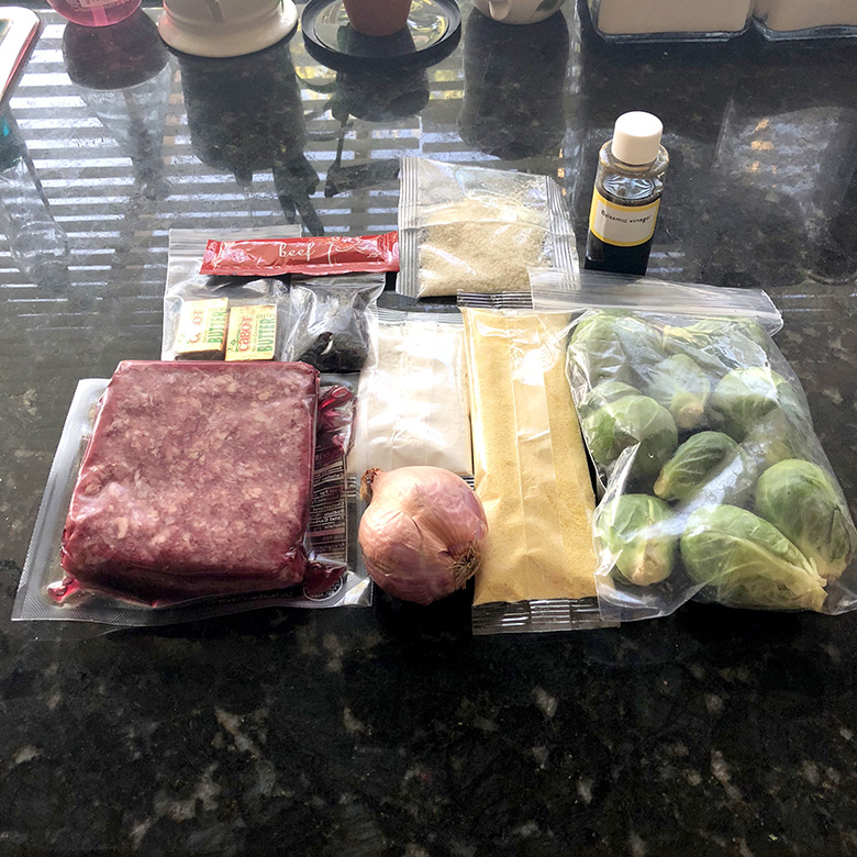 Unprepared and raw ingredients for the meatballs agrodolce with Brussels sprouts and polenta.