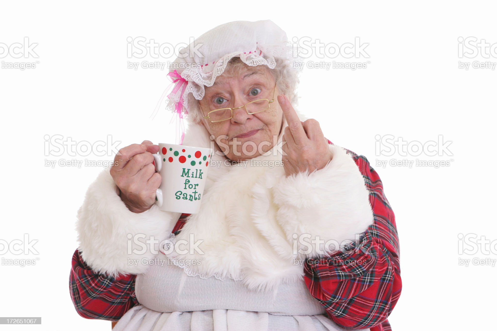 Stealing milk flip off Mrs Claus royalty-free stock photo