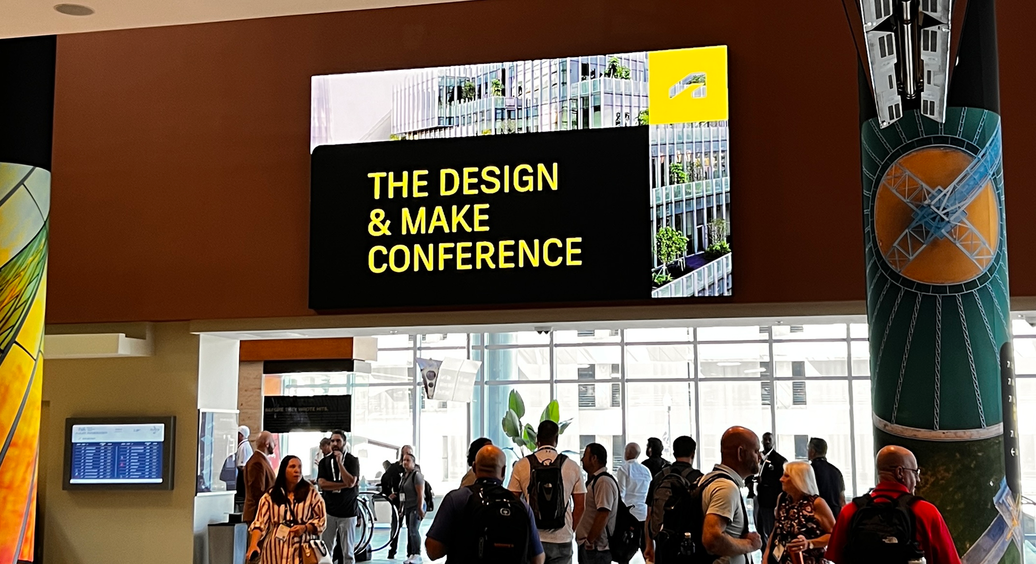 Expo hall entrance and exit doors with people walking through